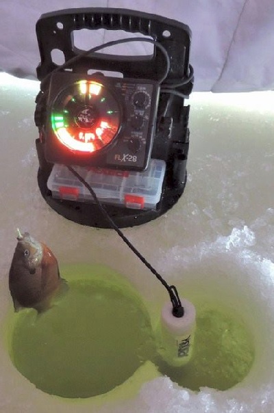 https://www.odumagazine.com/wp-content/uploads/2016/12/Dan-Getting-The-Ice-Fishing-Equipment-Ready.jpg